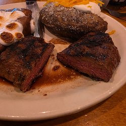 Texas Roadhouse - 8 ounce steak with a fully loaded sweet potato (marshmallows and carmel sauce), baked potato (sour cream, cheese & chives)