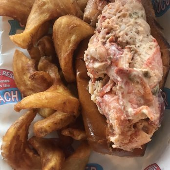 Pier 62 Oceanfront Restaurant & Bar - Lobster Roll & Seasoned Sidewinder Fries~ Spiced just right & sauced. The lobster was mouthwatering & tender & the fries were amazing! - Seafood Near Me - Cocoa Beach, Florida