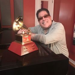 Hands in Motion Music School & Productions - Lannie Battistini with one of his Grammy Awards