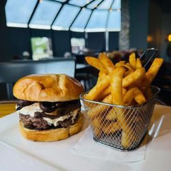 The Coterie Restaurant - The Trip Burger;
Beef patty, portabella mushroom, goat cheese, bacon-bourbon jam on a potato bun.