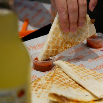 German Doner Kebab - a person putting ketchup on a quesadilla - Donairs Near Me - Surrey, British Columbia German Doner Kebab - a person putting ketchup on a quesadilla - Donairs Near Me - Surrey, British Columbia