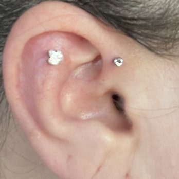Modern Mods - Chandler - Flat and forward helix. Jewelry on right was $10 upgrade. Flower was $50 beautiful in person. - Piercing Near Me - Chandler, Arizona Modern Mods - Chandler - Flat and forward helix. Jewelry on right was $10 upgrade. Flower was $50 beautiful in person. - Piercing Near Me - Chandler, Arizona