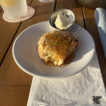 Quinn's - Cheddar biscuit with honey - Steakhouses Near Me - Marco Island, Florida Quinn's - Cheddar biscuit with honey - Steakhouses Near Me - Marco Island, Florida