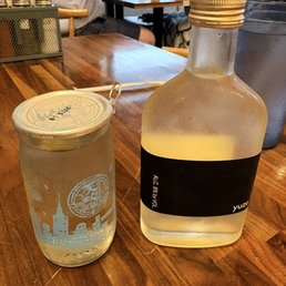 Left: Amabuki Shuzo junmai ginjo sake; Right: Shibata Shuzo yuzu sake Left: Amabuki Shuzo junmai ginjo sake; Right: Shibata Shuzo yuzu sake