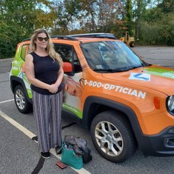Medford Optical - Chandra stands with her new Medford Optical vehicle.