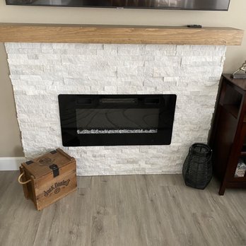 Luxe Remodeling - Fireplace insert, stone surround and mantle - General Contractors Near Me