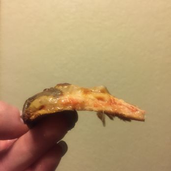 Pa's Pizzeria - a hand holding a piece of pizza - Pizza Near Me - Kenosha, Wisconsin
