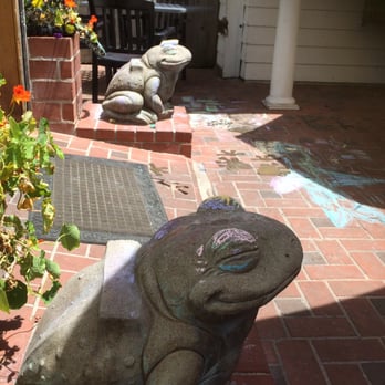 Coast Cafe - Froggy guardians of the Coast Cafe hold chalk to keep kids occupied while waiting for lunch. - New American Near Me - Bolinas, California Coast Cafe - Froggy guardians of the Coast Cafe hold chalk to keep kids occupied while waiting for lunch. - New American Near Me - Bolinas, California