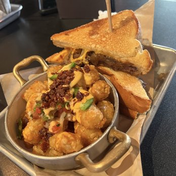 Rockhouse - Patty melt with loaded tator tots - Sports Bars Near Me - Las Vegas, Nevada Rockhouse - Patty melt with loaded tator tots - Sports Bars Near Me - Las Vegas, Nevada