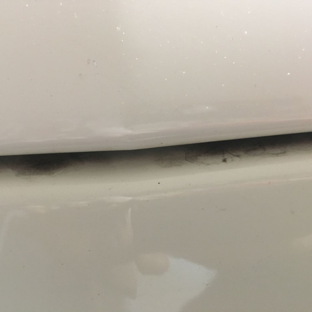 Top of the blanking plate on front of car. Plate can be removed if front license plate is required/desired. Lots of dirt left all around.