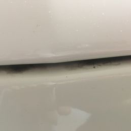 Top of the blanking plate on front of car. Plate can be removed if front license plate is required/desired. Lots of dirt left all around.