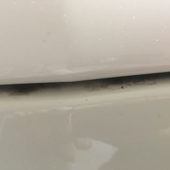 Bubbles On Wheels - Top of the blanking plate on front of car. Plate can be removed if front license plate is required/desired. Lots of dirt left all around. - Auto Detailing Near Me - Orlando, Florida
