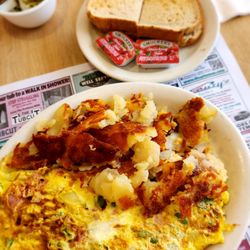 Town & Country Restaurant - Western omelet with cheddar cheese, home fries and toast.