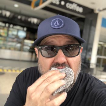 Coolangatta Pie Shop - Me eating a Lamington. So good. - Bakeries Near Me - Coolangatta, QLD