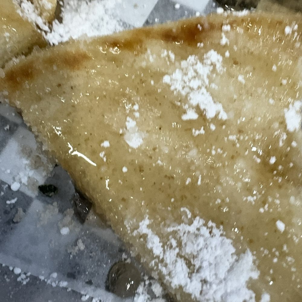 Simply Greek - Getting up close and personal with a dessert pita bread that has granulated sugar, powdered sugar and syrup port all over it while warm. - Greek Near Me - Cypress, Texas Simply Greek - Getting up close and personal with a dessert pita bread that has granulated sugar, powdered sugar and syrup port all over it while warm. - Greek Near Me - Cypress, Texas