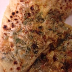 Pancake with meat, cheese, and spinach. Made by the lady at the restaurant window. It was ok, but I wouldn't order again.