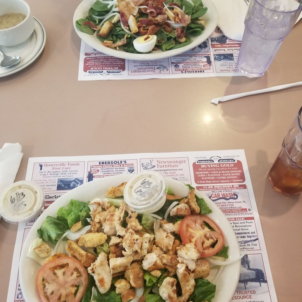 Chicken cesar salad (foreground) and spinach salad.
