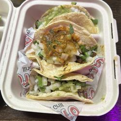 Tacos Al Pastor in Corn Tortillas with Cilantro, onions, salsa verde, and salsa Rojas.