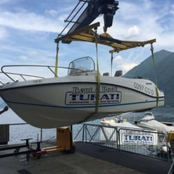 Rent A Boat Turari - Lowering a Boat to the water