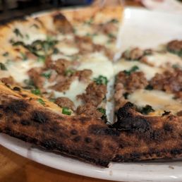 a pizza on a plate a pizza on a plate