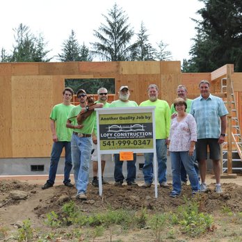 Lofy Construction - a group of people standing in front of a house under construction - General Contractors Near Me - Florence, Oregon Lofy Construction - a group of people standing in front of a house under construction - General Contractors Near Me - Florence, Oregon
