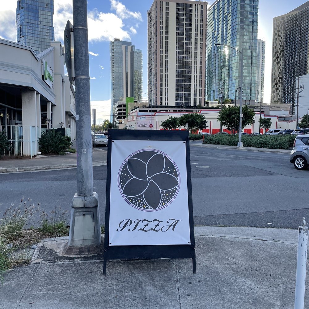 Floralia - a sign on the corner of a city street - Italian Near Me - Honolulu, Hawaii