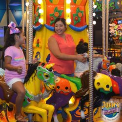 John's Incredible Pizza - Carson - Three large rides including a carousel, roller coaster, and bumper cars.