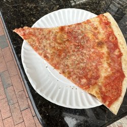 Bay Village Pizza - Pizza slice after adding spices