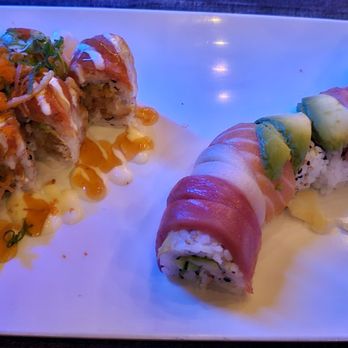 Pisces Sushi & Global Bistro - Left - Dunedin's Dream / Right - Rainbow Roll - Sushi Bars Near Me - Dunedin, Florida Pisces Sushi & Global Bistro - Left - Dunedin's Dream / Right - Rainbow Roll - Sushi Bars Near Me - Dunedin, Florida