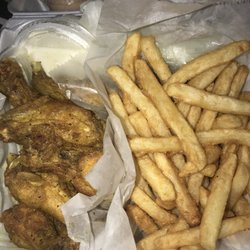 Wing World - Lemon pepper wings, reg fries which are better than curly fries in my opinion.. just trust me on that, w blue cheese and chipotle ranch