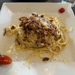 Carbonara topped with guanciale