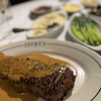 Luckys Steakhouse - New York Pepper Steak, 14 oz. with Cognac - Steakhouses Near Me - Montecito, California Luckys Steakhouse - New York Pepper Steak, 14 oz. with Cognac - Steakhouses Near Me - Montecito, California