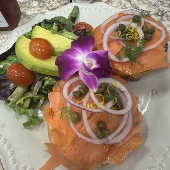 Harvest Kitchen & Bakery - Salmon Lox on a bagel, fried goat cheese, greens w/avocado. - Breakfast & Brunch Near Me - Katy, Texas Harvest Kitchen & Bakery - Salmon Lox on a bagel, fried goat cheese, greens w/avocado. - Breakfast & Brunch Near Me - Katy, Texas