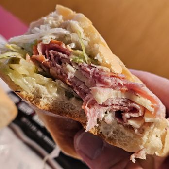Jimmy John's - Close-up of me holding the Italian Night Club Sub while eating it - Sandwiches Near Me - Roanoke, Virginia