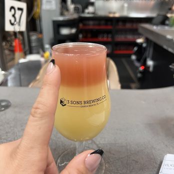 3 Sons Brewing - Austin is the BEST!!!! Made me this Rocket Pop layered on the Smooth Ops Piña Colada seltzer.  My bf and I love this place. - Breweries Near Me - Dania Beach, Florida