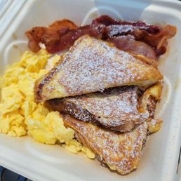 French toast meal with bacon and scrambled eggs