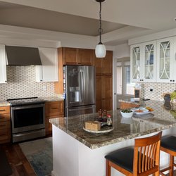 Cyn's Cucina - Stone countertops, backsplash, glass door fronts-it's all about the details!