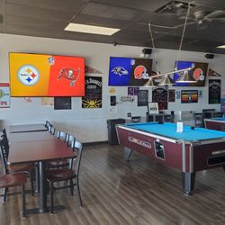 Nikki's Tavern - Game room with additional seating and screens