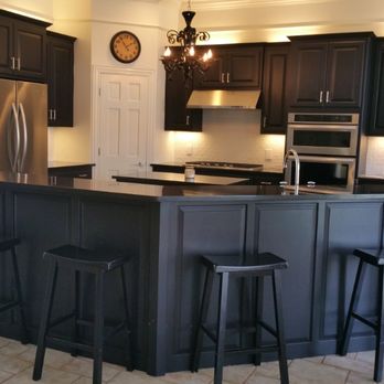 CMW Remodel - a kitchen with a center island - Flooring Near Me