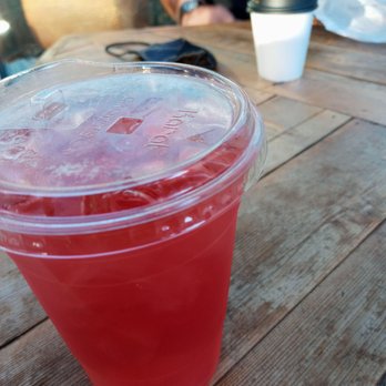 Cognoscenti Coffee - Tangerine ginger iced tea in front and to-go Cortado in back - Coffee & Tea Near Me - Los Angeles, California