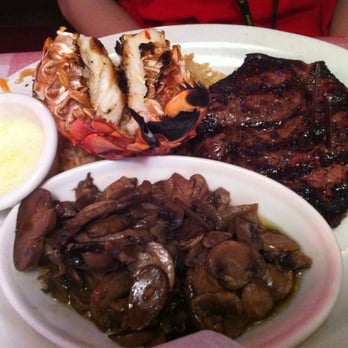 Logan's Roadhouse - Steak & lobster medium well w/grilled mushrooms & caesar salad (not shown). - Steakhouses Near Me - Manassas, Virginia Logan's Roadhouse - Steak & lobster medium well w/grilled mushrooms & caesar salad (not shown). - Steakhouses Near Me - Manassas, Virginia