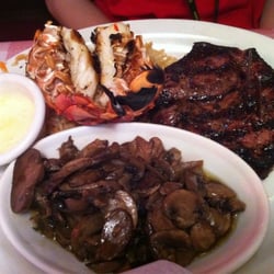 Logan's Roadhouse - Steak & lobster medium well w/grilled mushrooms & caesar salad (not shown).