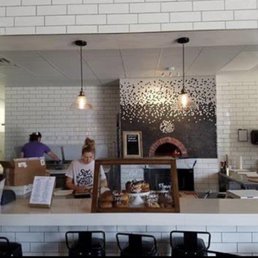 Pastry and pizza order area with oven in background. Pastry and pizza order area with oven in background.