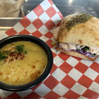 The Kitchen Sink - The Goat with Parm Artichoke Soup - Sandwiches Near Me - Wilmington, North Carolina The Kitchen Sink - The Goat with Parm Artichoke Soup - Sandwiches Near Me - Wilmington, North Carolina