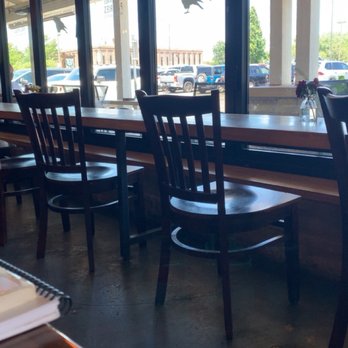 Crows Coffee Red Bridge - Midway high top facing the street with patio tables outside the window - Coffee & Tea Near Me - Kansas City, Missouri Crows Coffee Red Bridge - Midway high top facing the street with patio tables outside the window - Coffee & Tea Near Me - Kansas City, Missouri