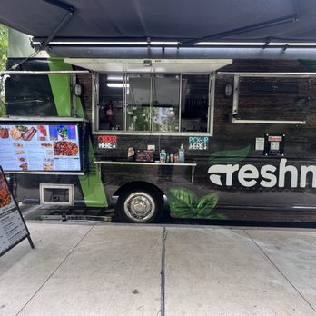 Klyde Warren Park - A few food trucks. This is a West African cuisine food truck - you can customize your own Jollof bowl - Parks Near Me - Dallas, Texas