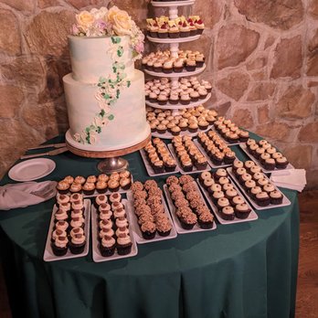 Natty Cakes - a table full of cupcakes - Custom Cakes Near Me Natty Cakes - a table full of cupcakes - Custom Cakes Near Me