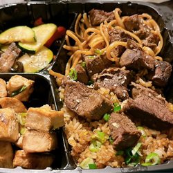 Steak & Chicken Combo with Fried Rice, Noodles, Veggies & side of sauce (not sure which sauce)