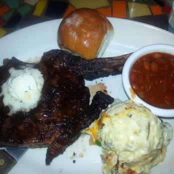 Bone Daddy's - Juicy bone-in rib-eye steak with cheese spuds and skillet beans! - Barbeque Near Me - Arlington, Texas