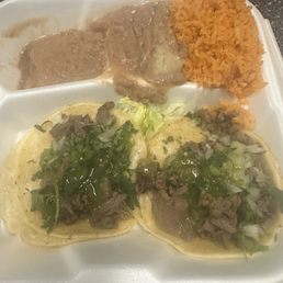 Two asada tacos with rice and beans Two asada tacos with rice and beans